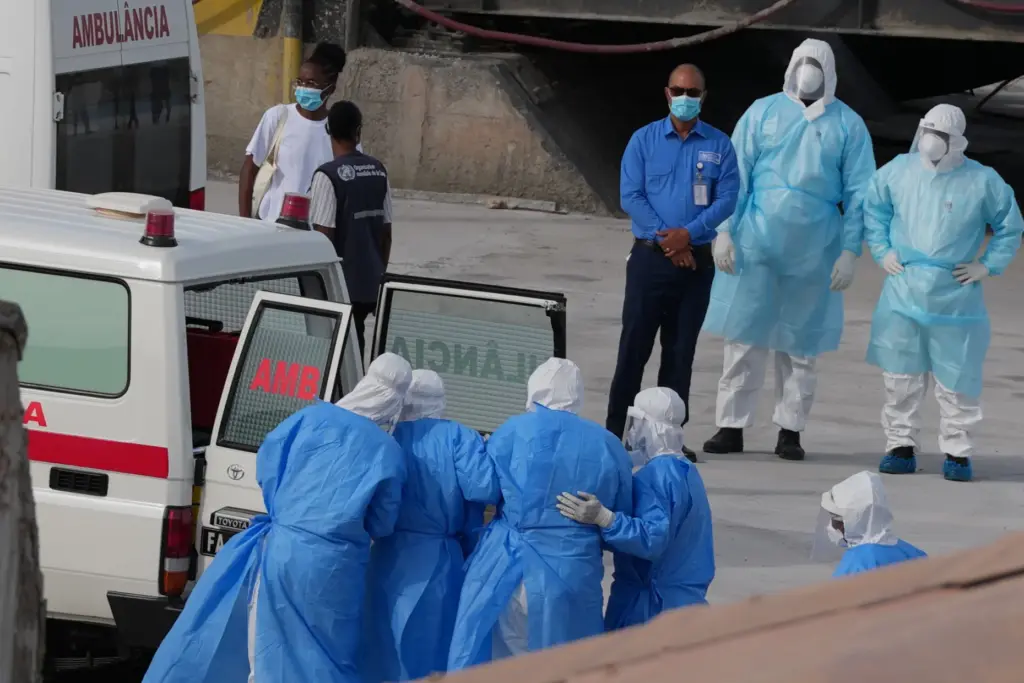 Health workers in protective gear arrive to evacuate patients from the MV Hondius cruise ship.