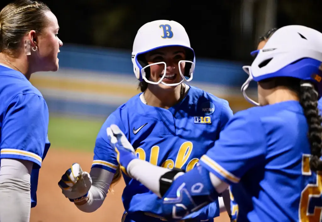 Aleena Garcia #21 of the UCLA Bruins reacts after hitting...