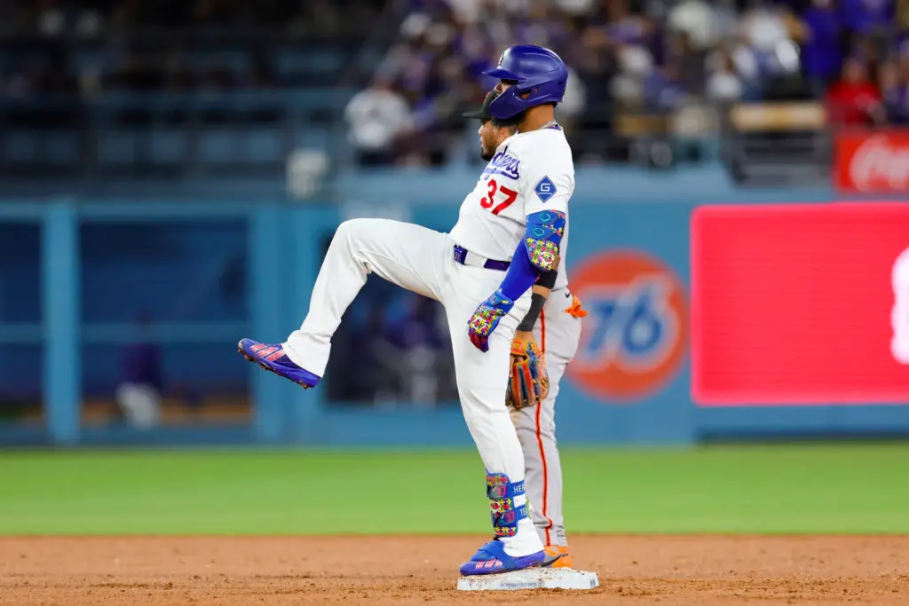 The Dodgers’ Teoscar Hernandez celebrates at second base after hitting...
