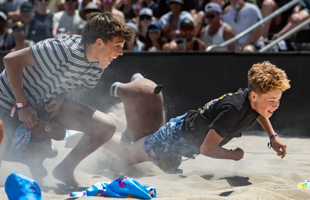 Fans take part in a light-hearted race during a break...