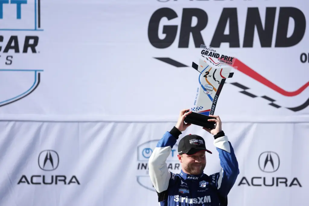 Indycar driver Felix Rosenqvist celebrates after finishing second in the...