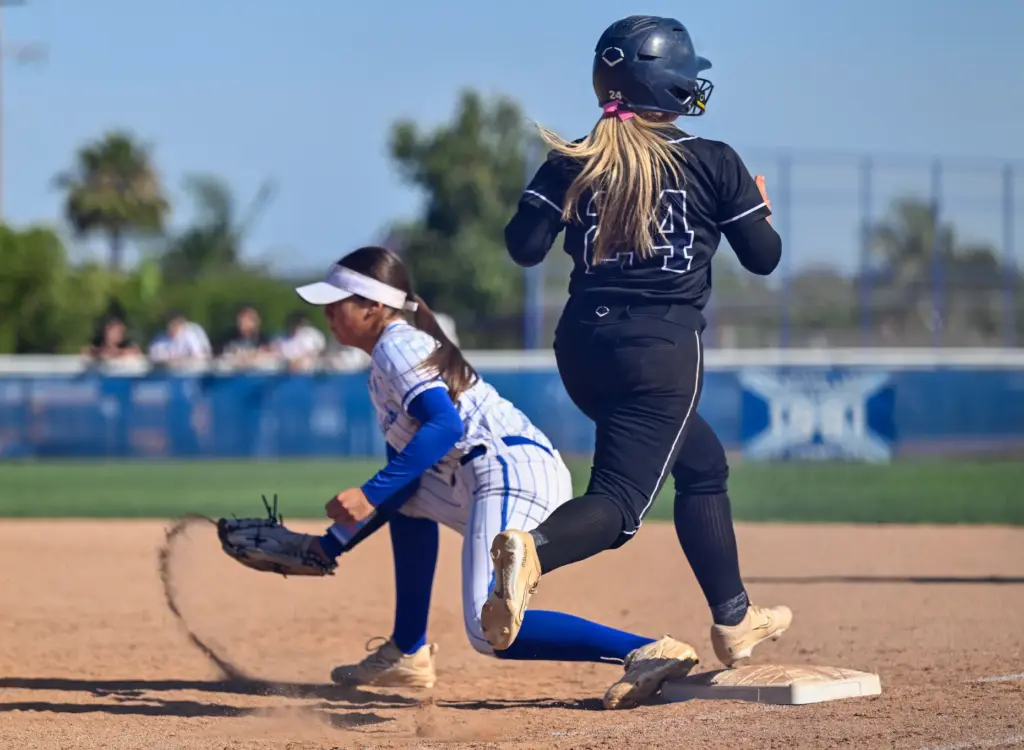 La Habra first baseman Rylee Gruener scoops the ball out...