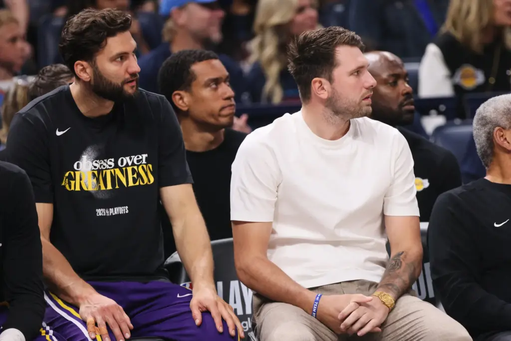 Los Angeles Lakers’ Maxi Kleber, left, and Luka Doncic, right,...