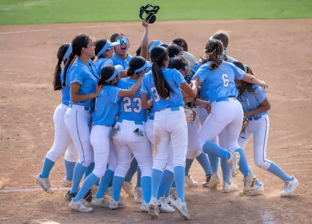 Irvine players celebrate the teamsâ 15-2 win over Arroyo during...