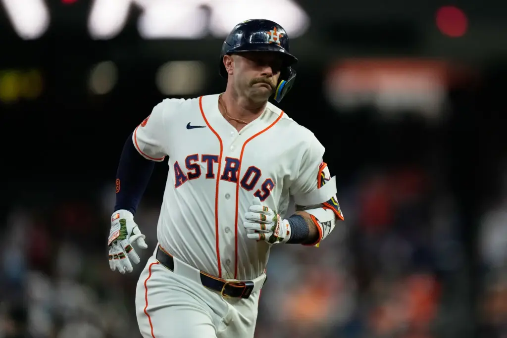 Houston Astros designated hitter Christian Walker runs the bases after...