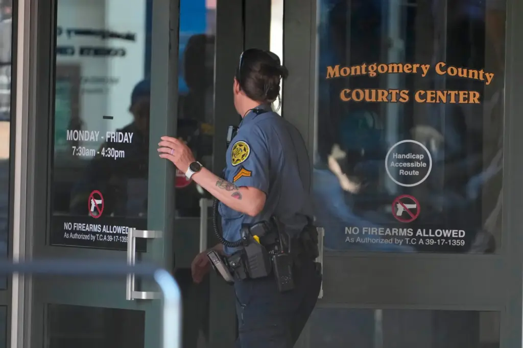 A Sheriff’s deputy enters the Montgomery County Courts Center as...