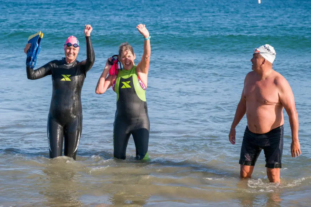 Swimmers, from left, Val Bath, Maria Korcsmaros and Steve Robles...