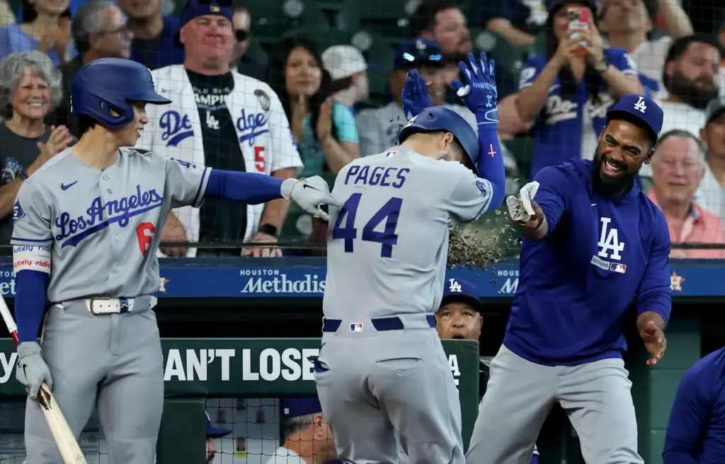 The Dodgers’ Andy Pages, center, is congratulated by teammates Hyeseong...