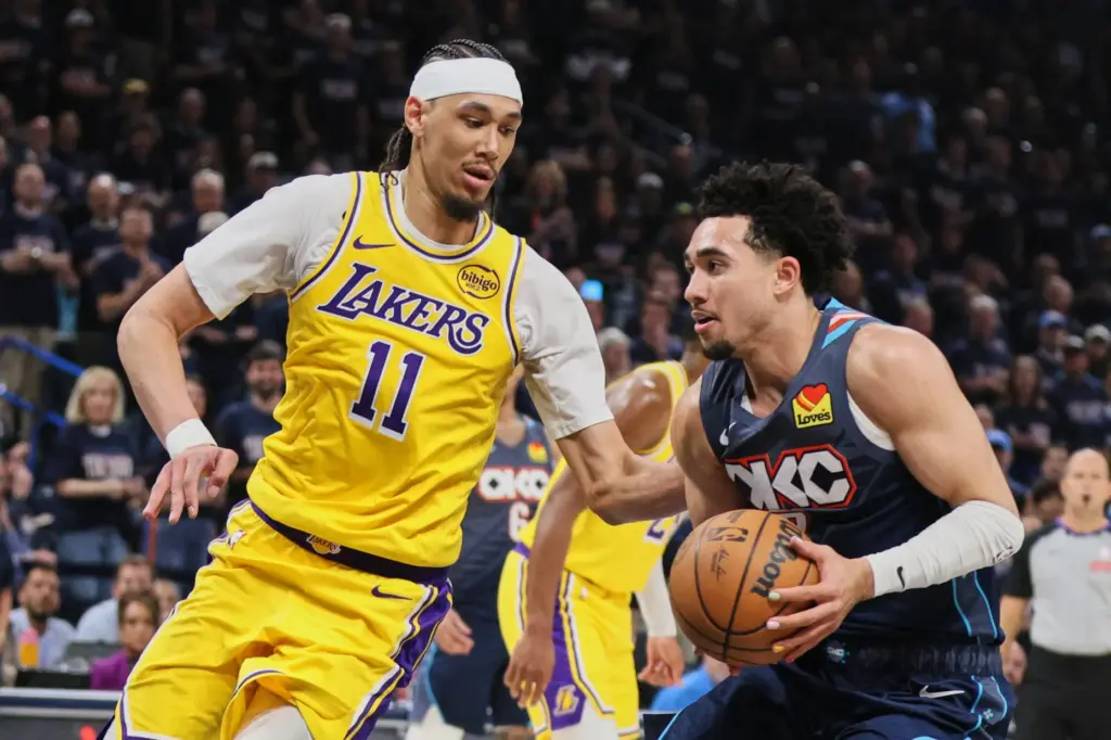 Oklahoma City Thunder guard Jared McCain, right, works to take...