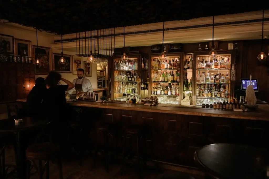 People spend time at an almost empty bar on Hamra Street in Beirut.