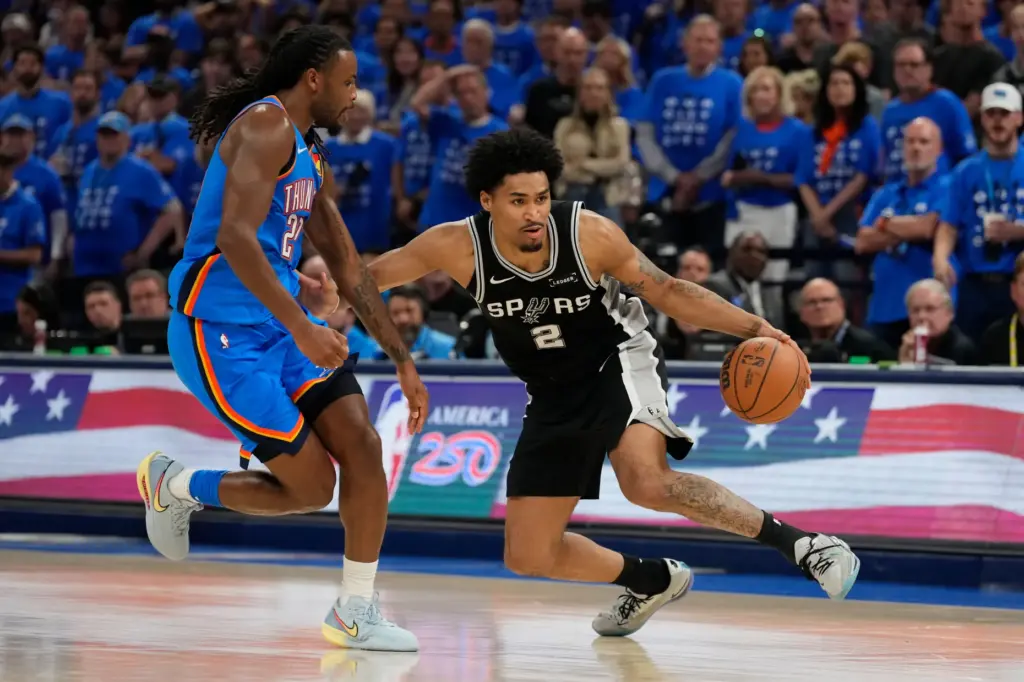 San Antonio Spurs guard Dylan Harper (2) dribbles the ball...