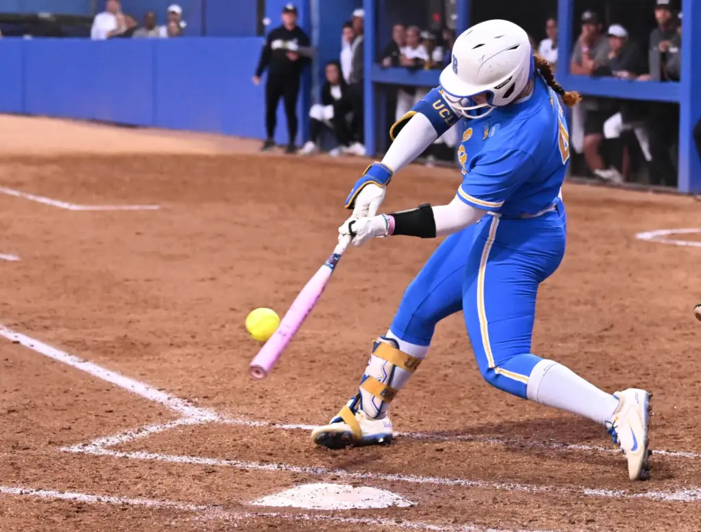Megan Grant #43 of the UCLA Bruins hits a sac...
