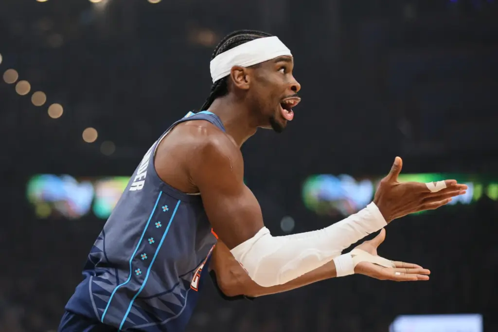 Oklahoma City Thunder guard Shai Gilgeous-Alexander reacts to an officials...