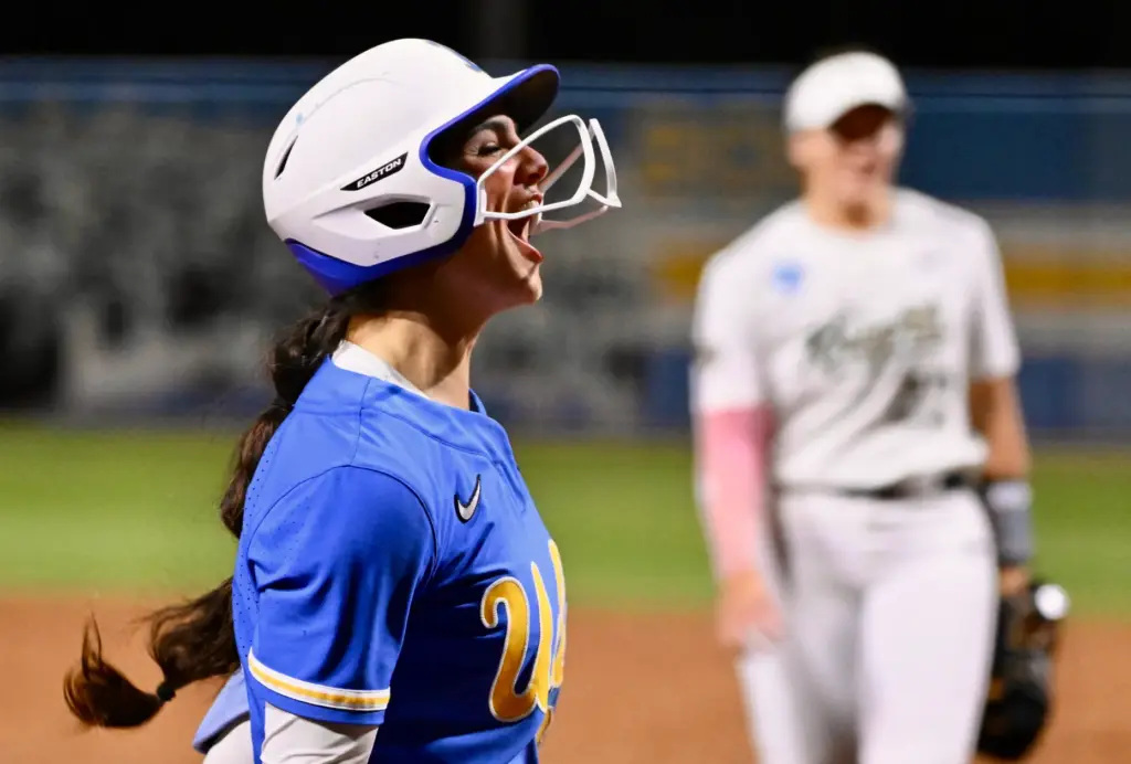Aleena Garcia #21 of the UCLA Bruins reacts after hitting...