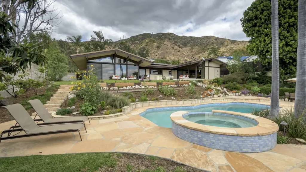 The Altadena home, designed by Buff, Smith and Hensman, is...