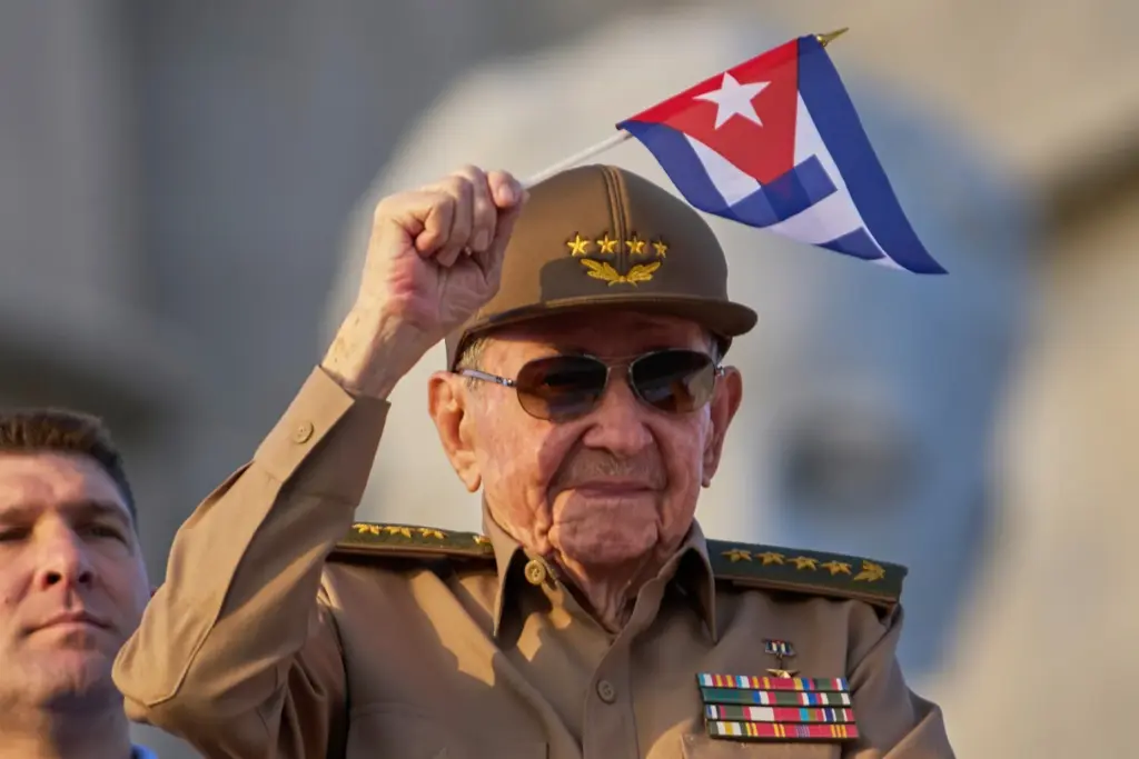 Raul Castro waves a Cuban national flag