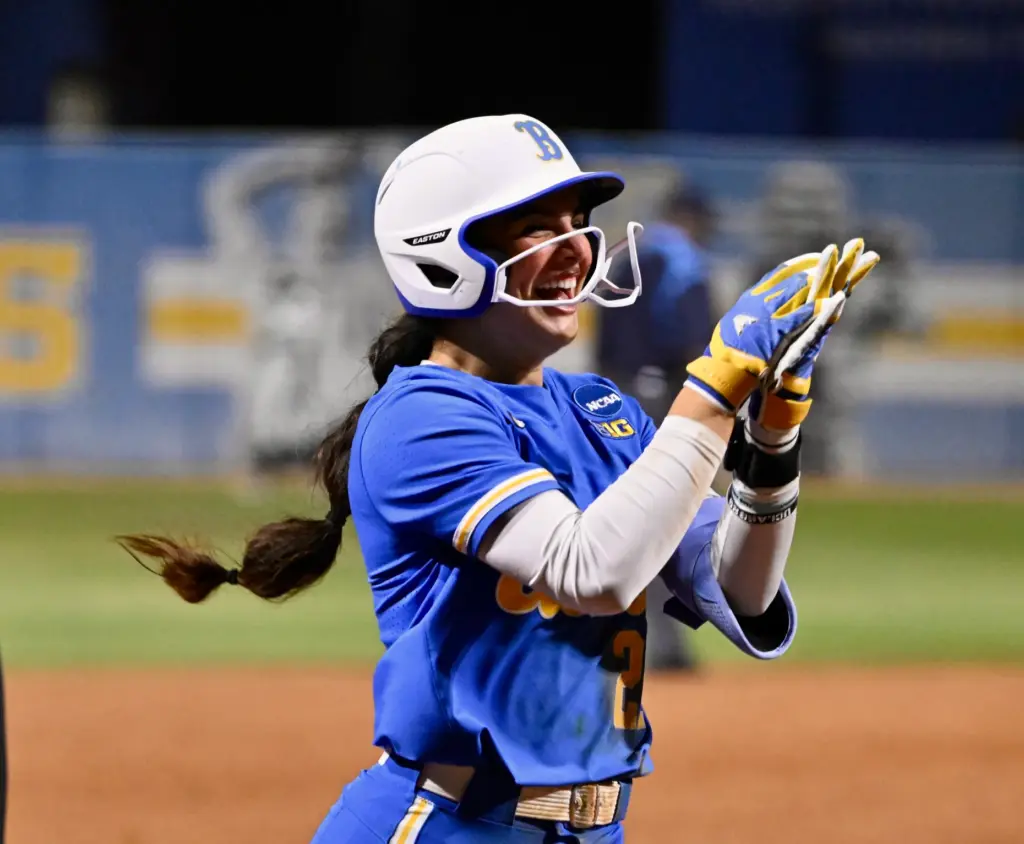 Aleena Garcia #21 of the UCLA Bruins reacts after hitting...