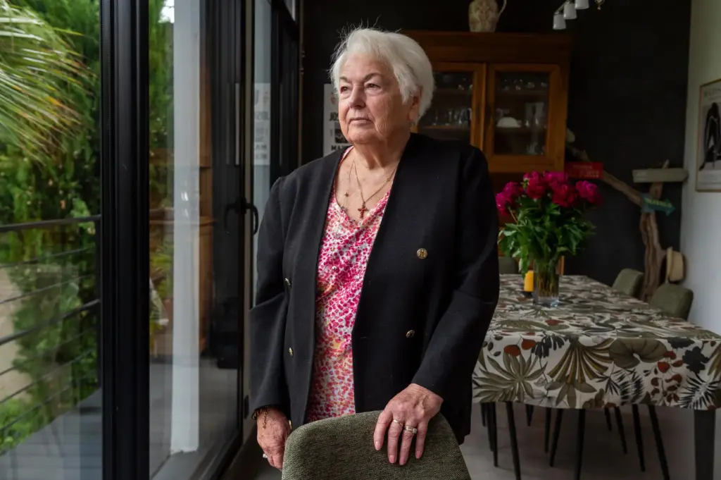 Marie-Therese Ross-Mahe, an 85-year-old French widow of a U.S. military veteran, poses in Orvault, France.