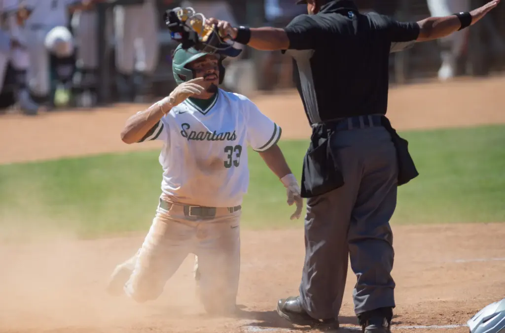 Schurrâs Javon Bryant (#33), is called safe at home plate...