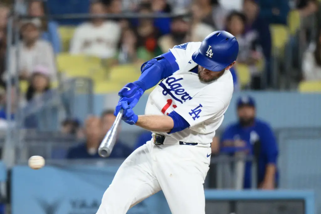 The Dodgers’ Max Muncy hits an RBI single during the...