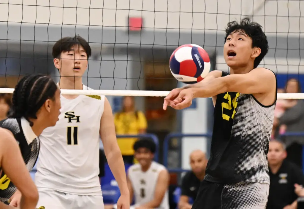 Micah Park #26 of the Royal Highlanders sets up a...