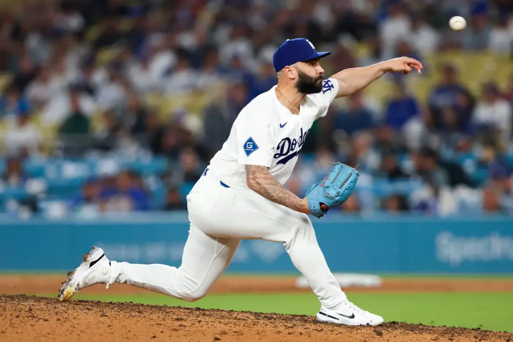 Dodgers relief pitcher Tanner Scott throws to the plate during...