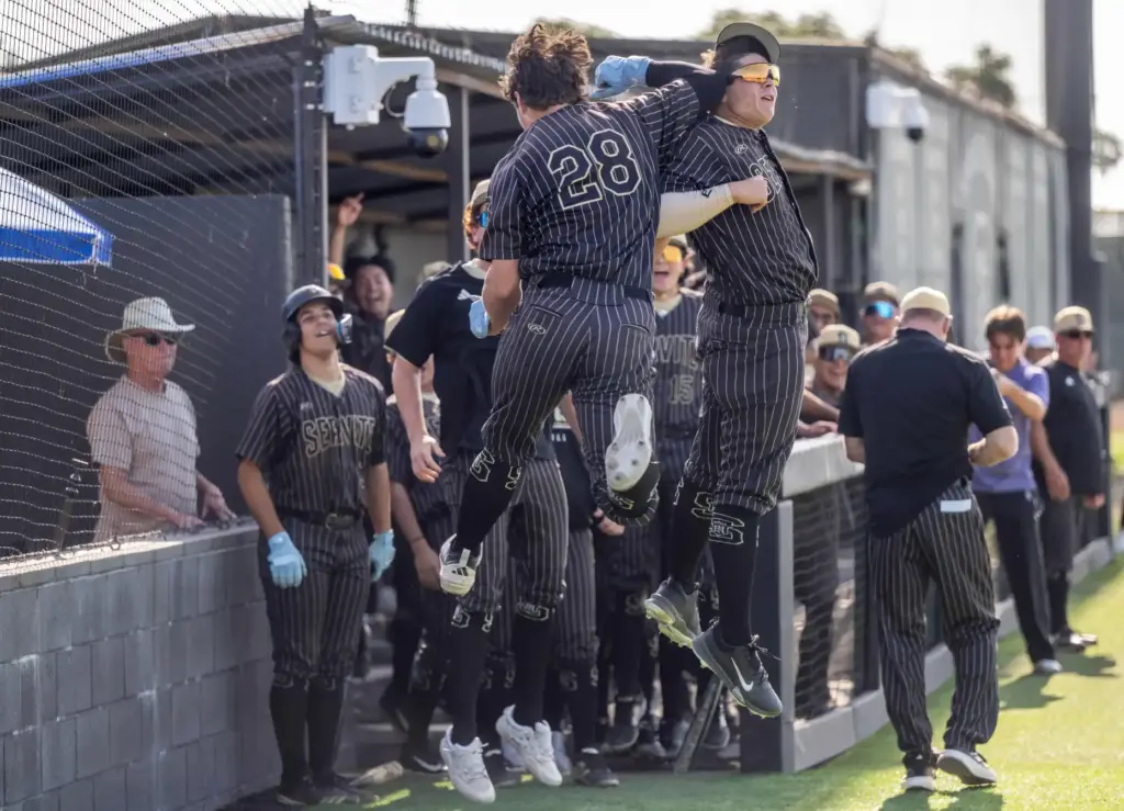 Teammates celebrate as Serviteâs Eli Rubel is welcomed back to...