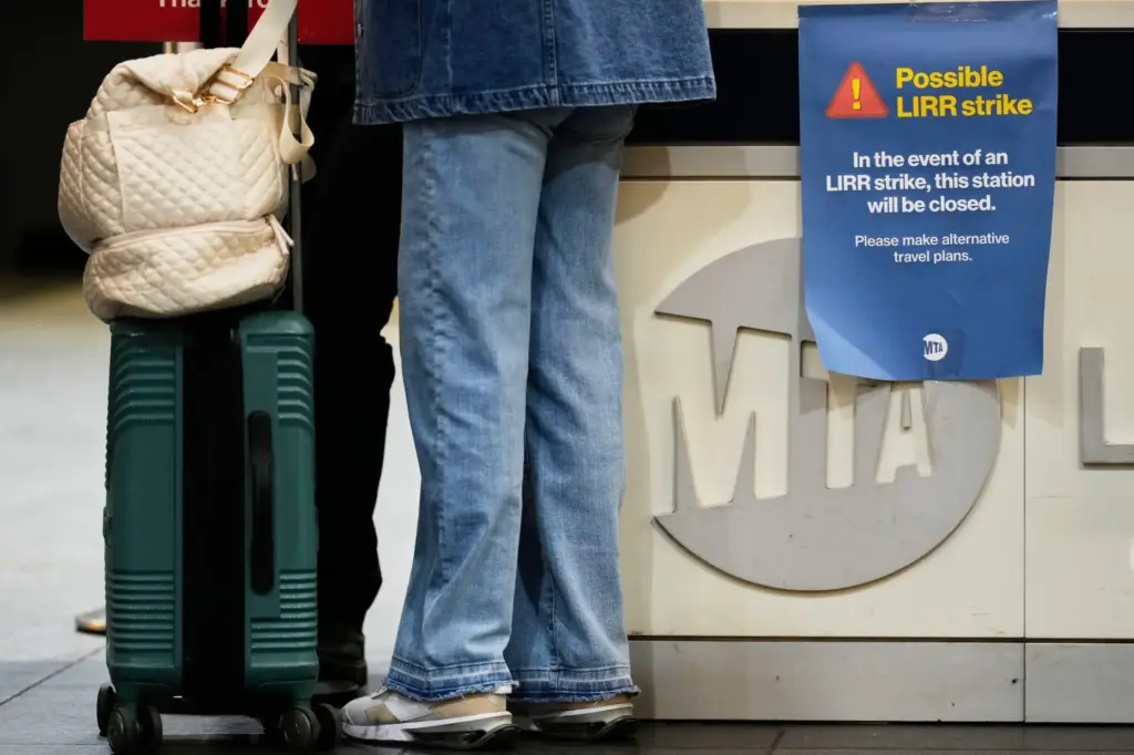 A sign warns commuters of a potential Long Island Rail Road strike at Penn Station.