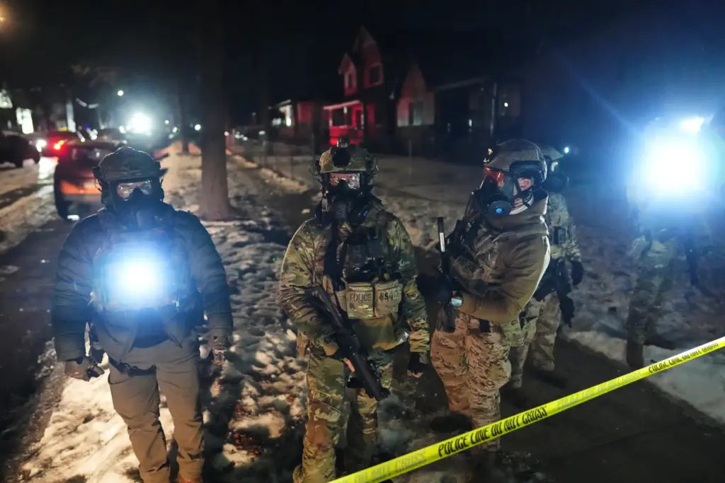 FILE – Law enforcement officers at the scene of a...