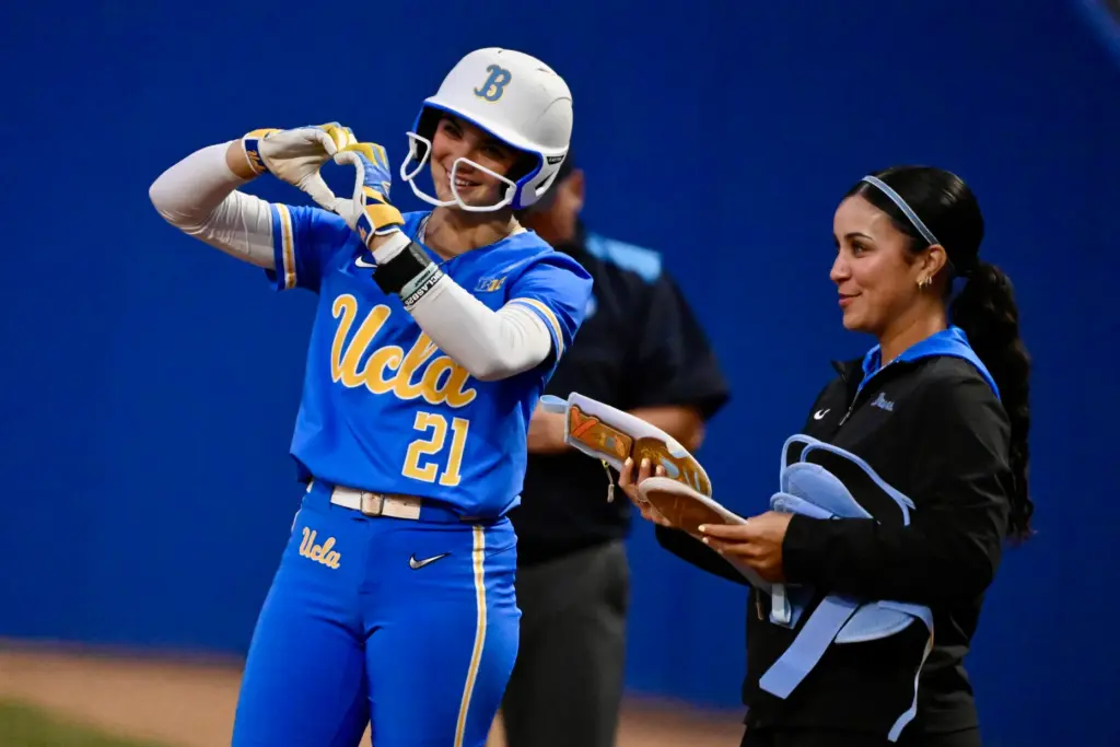 Aleena Garcia #21 of the UCLA Bruins reacts after a...