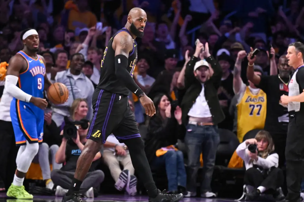Lakers star LeBron James walks to the sideline during the...