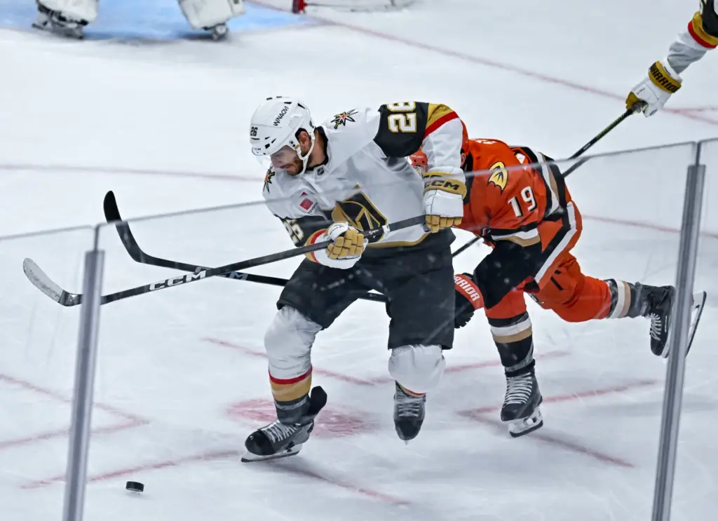 The Golden Knightsâ Nic Dowd (26) controls the puck during...