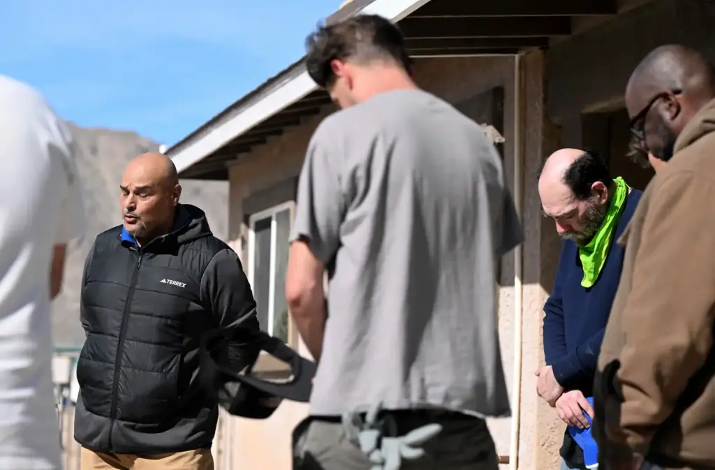 River’s Edge Ranch spirtual director Ernesto Izquierdo, left, 49, leads...