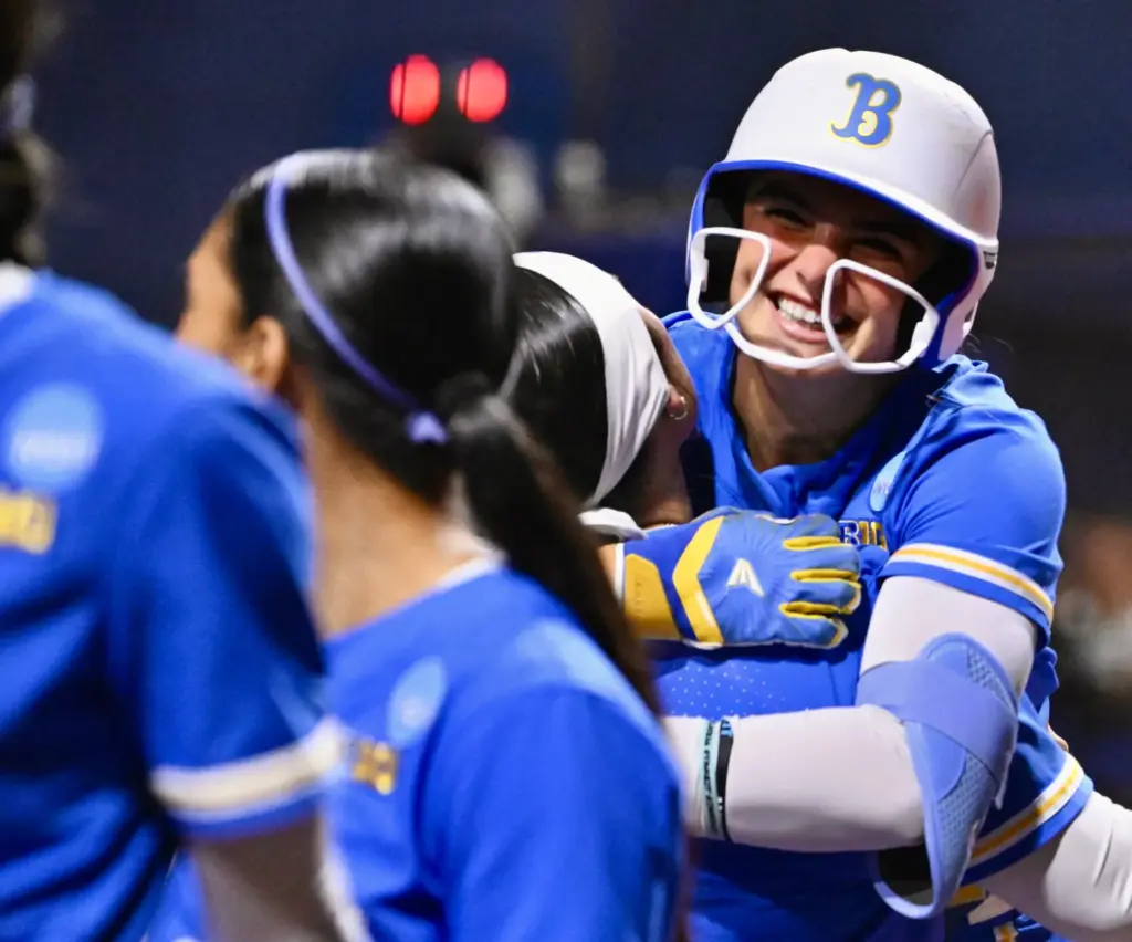Aleena Garcia #21 of the UCLA Bruins jumps into the...