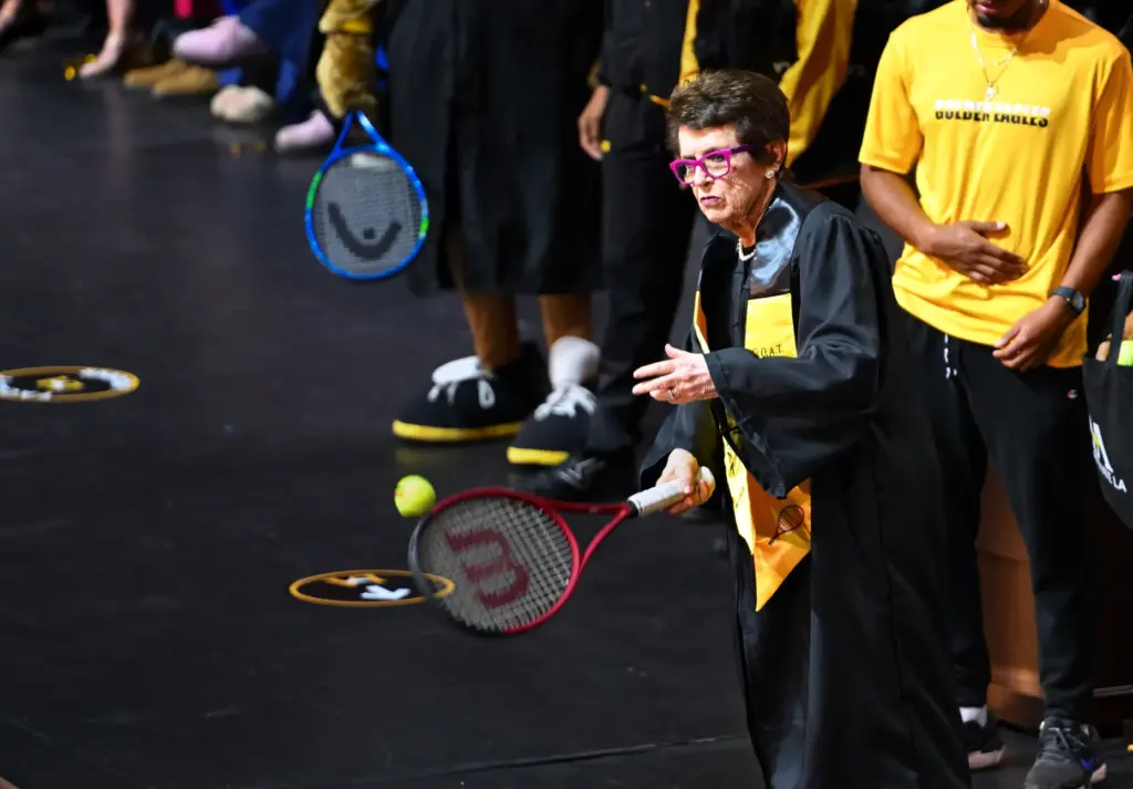 Billie Jean King joins student athletes on stage as she...