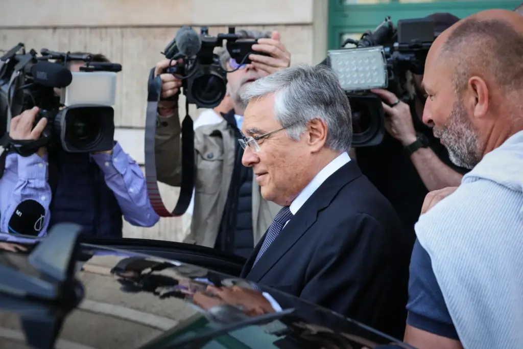 Russia's ambassador to Hungary, Evgeny Stanislavov, is surrounded by media.