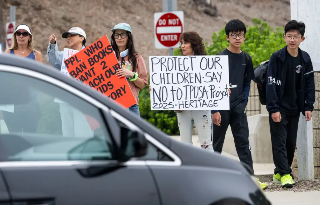 Students go to class Friday, May 8, 2026, as people...