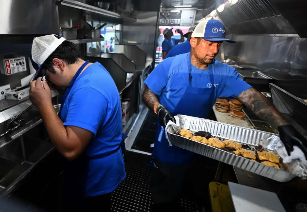 River’s Edge Ranch ârancherâ Miguel Castillo, right, 40, prepares smash...