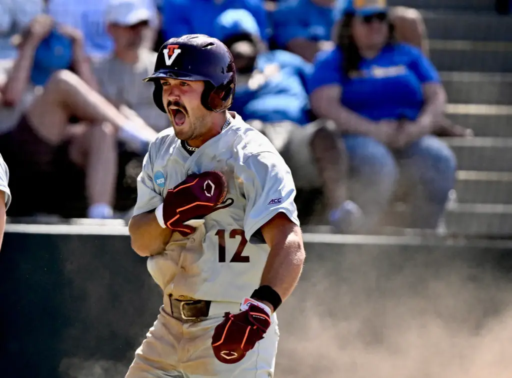 Ethan Gibson #12 of the Virginia Tech Hokies reacts after...