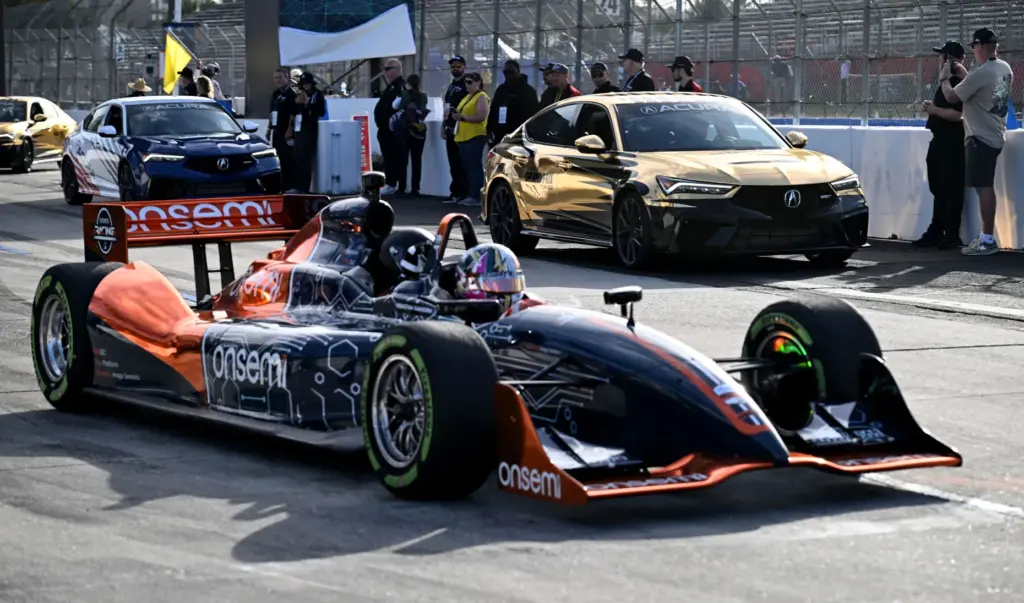 Race fans participate in the VIP track activities during the...