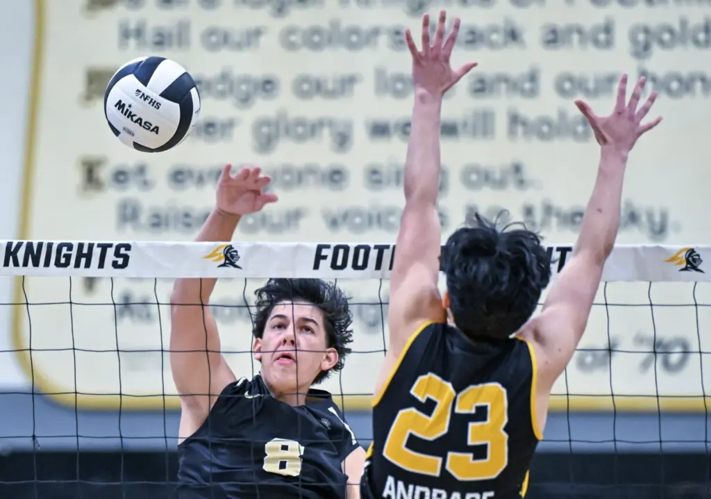Serviteâs John Burdge hits the ball past Foothillâs Archer Andrade...