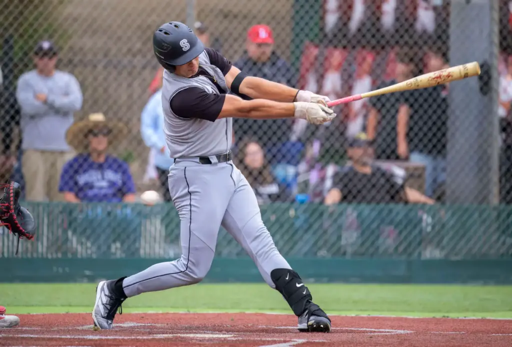 Santiago’s Max Eldridge swings and misses for a strike against...