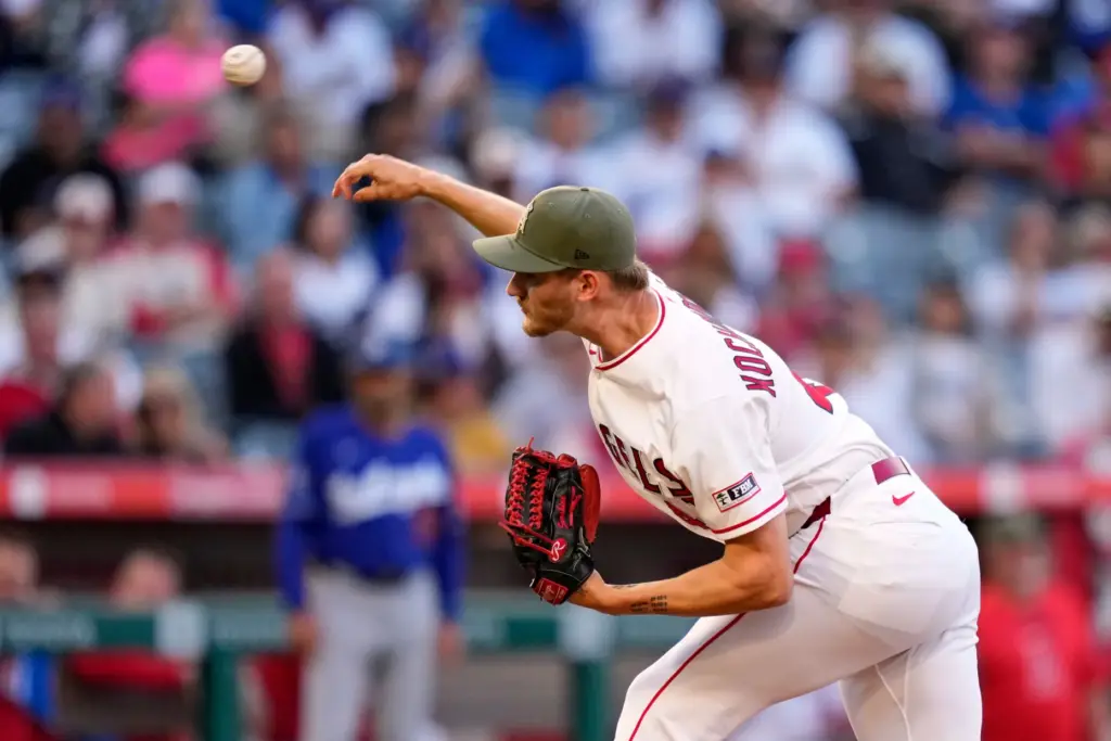 Angels starting pitcher Jack Kochanowicz throws to the plate during...