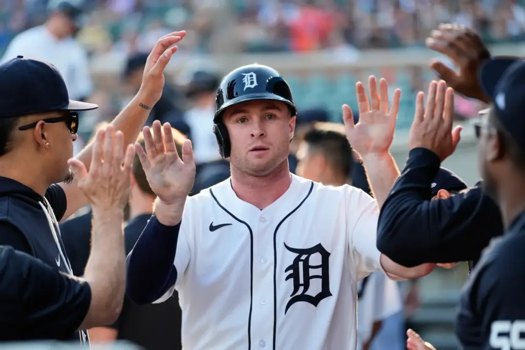 The Detroit Tigers’ Colt Keith celebrates in the dugout after...