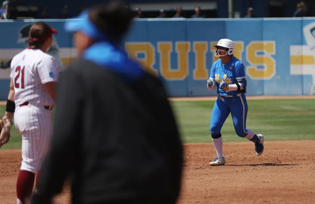 UCLAâs Bri Alejandre celebrates after hitting a two-run homer against...