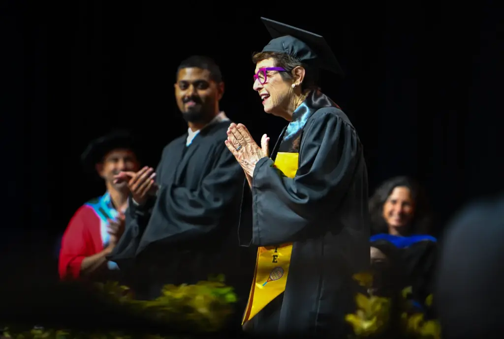 Billie Jean King walks the stage as she receives her...