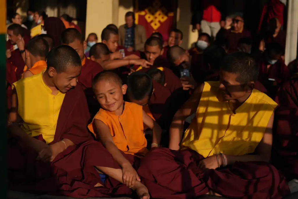 Young monks smile during a break from rituals and teachings...