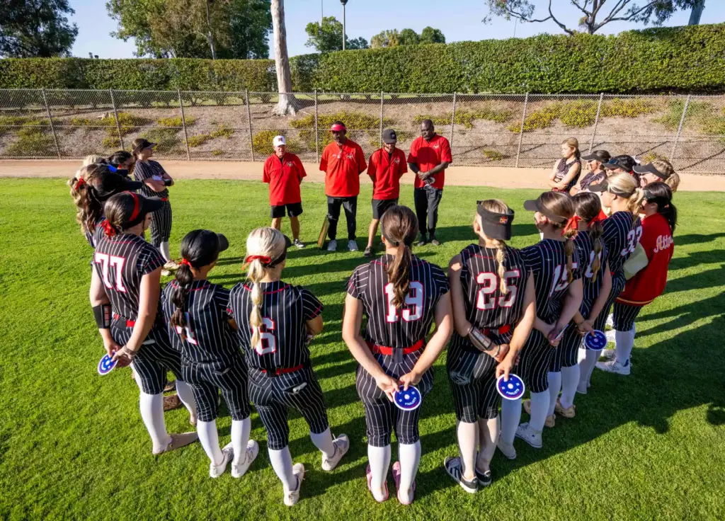 Mission Viejo players listen to words of encouragement from their...