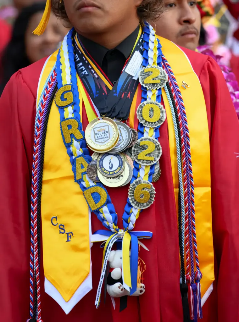 Honors and awards are proudly worn by a graduate at...