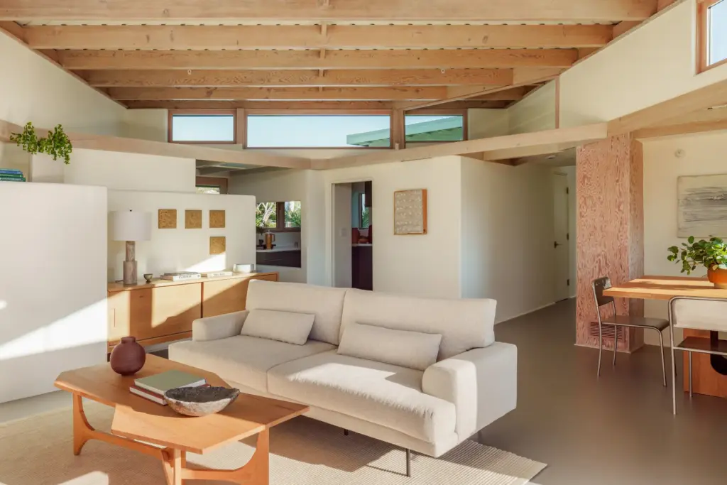 The main living area connects to a bedroom hallway, right,...